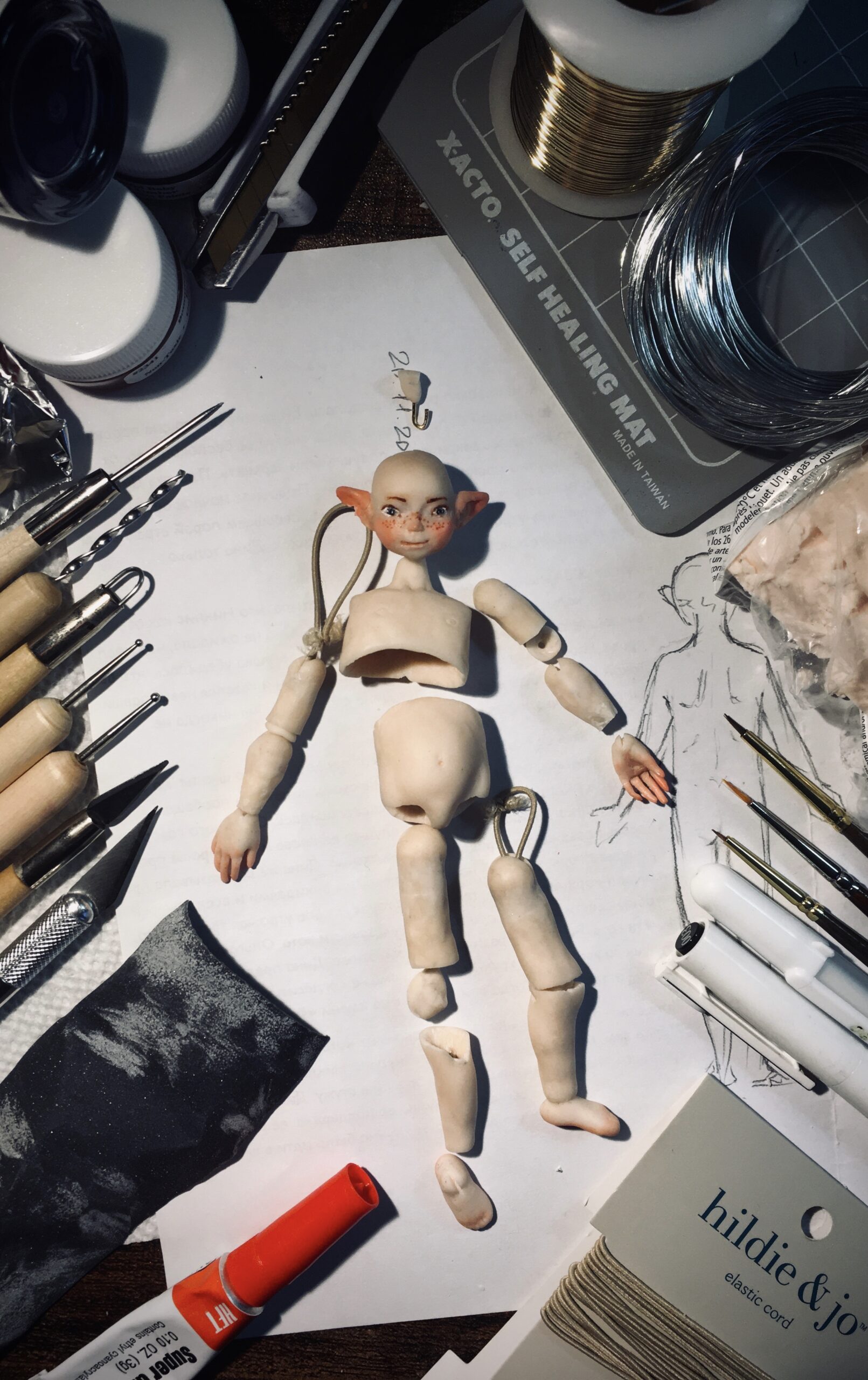 Disassembled doll and tools